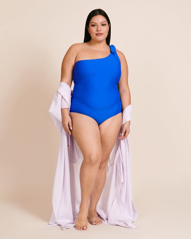 Front of a model wearing a size 16 Now Or Never One Piece in Blue by Saint Somebody. | dia_product_style_image_id:227976